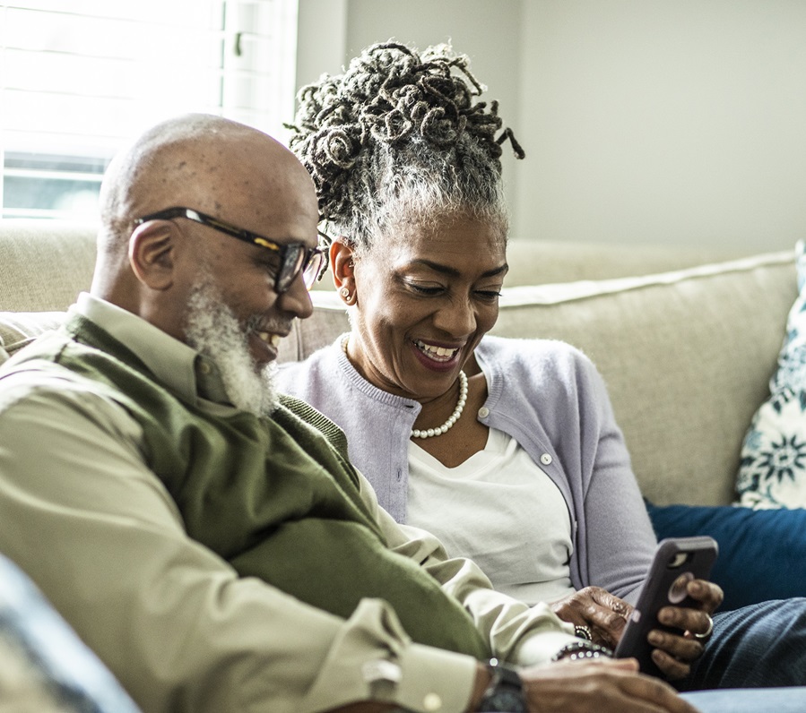 Couple looking for hospice care online