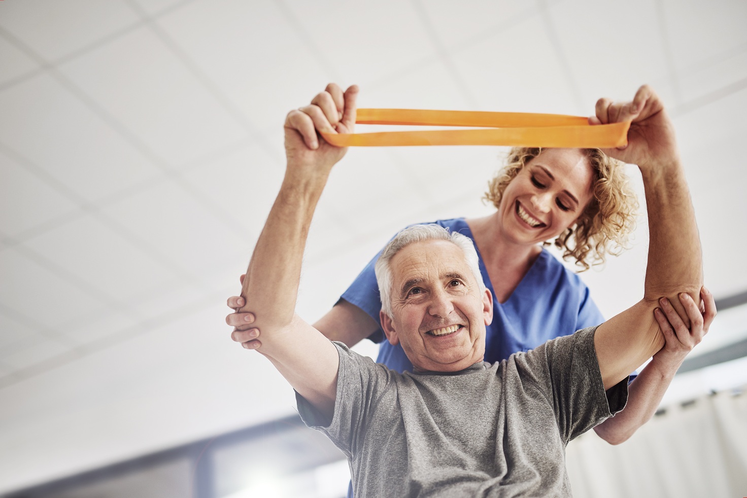 Caregiver helping patient stretch